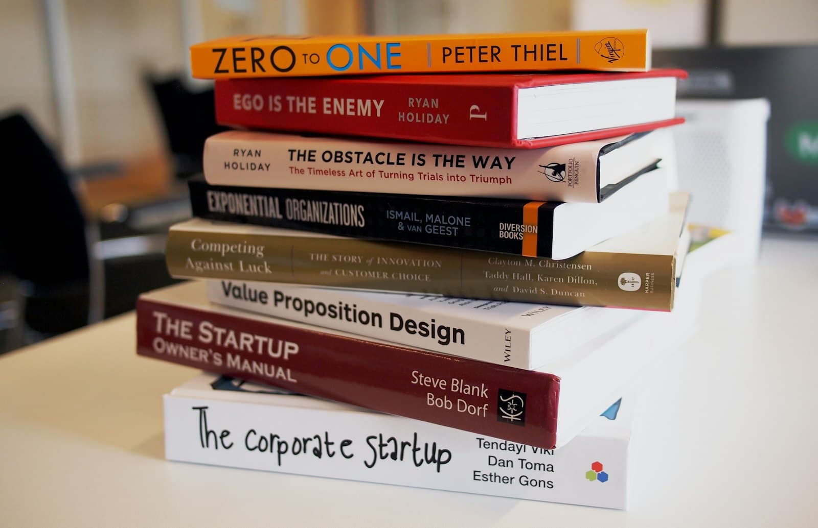 Stack of colourful physical books ready to be passed to the next reader